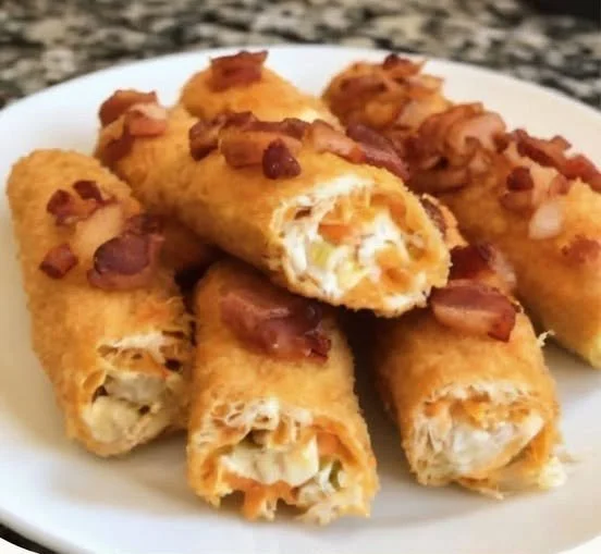 Buffalo Chicken Cheese Stick Bombs with bacon and cheese on a plate
