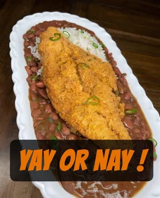 Fried Catfish with Red Beans & Rice Plate of fried catfish served with red beans and rice
