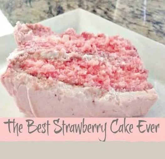 Delicious homemade strawberry cake topped with fresh strawberries and whipped cream