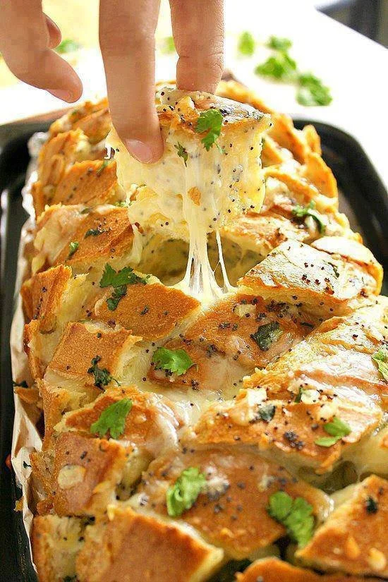 Delicious cheesy garlic bread with melted cheese and garlic butter, perfect for sharing.
