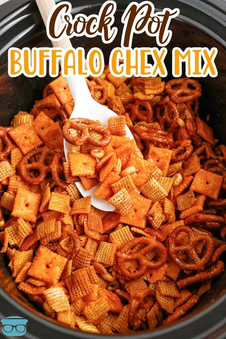 Crock Pot Buffalo Ranch Chex Mix Crock Pot Buffalo Ranch Chex Mix in a serving bowl garnished with herbs.