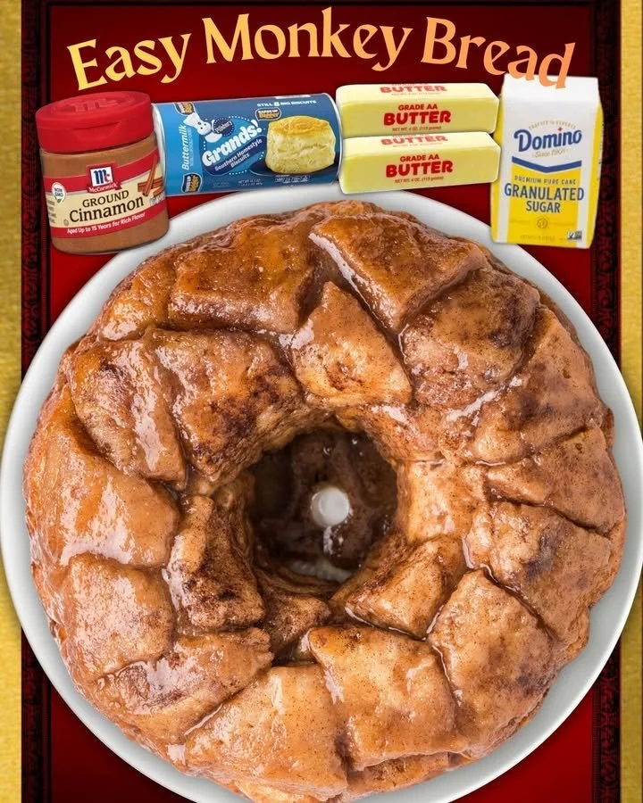 Freshly baked Monkey Bread, golden and sticky, served on a plate.